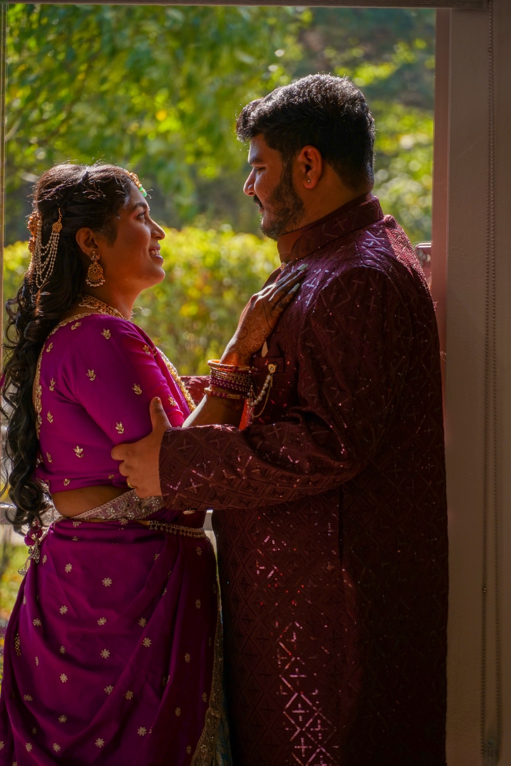 The couple sharing a quiet moment in warm light